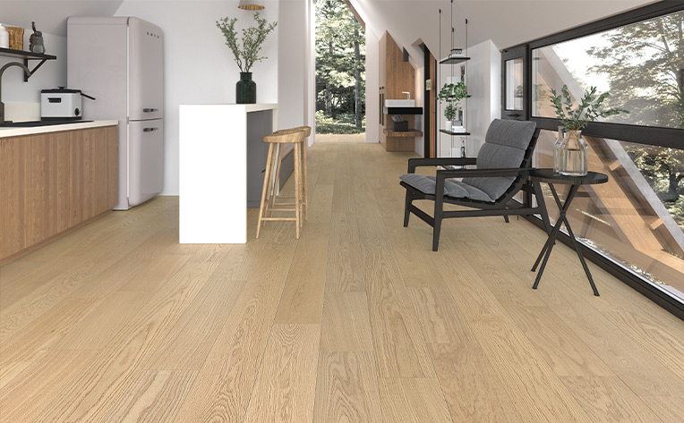 warm toned hardwood flooring in half kitchen